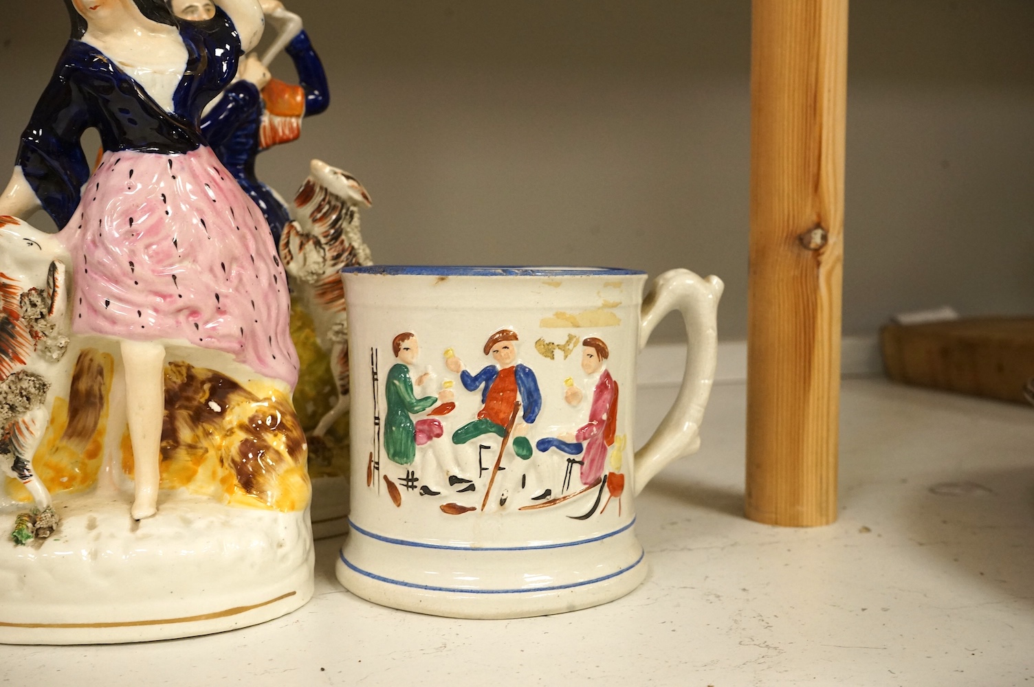 A collection of Staffordshire figures, mostly flatback to include a pocket watch holder, largest 37cm high